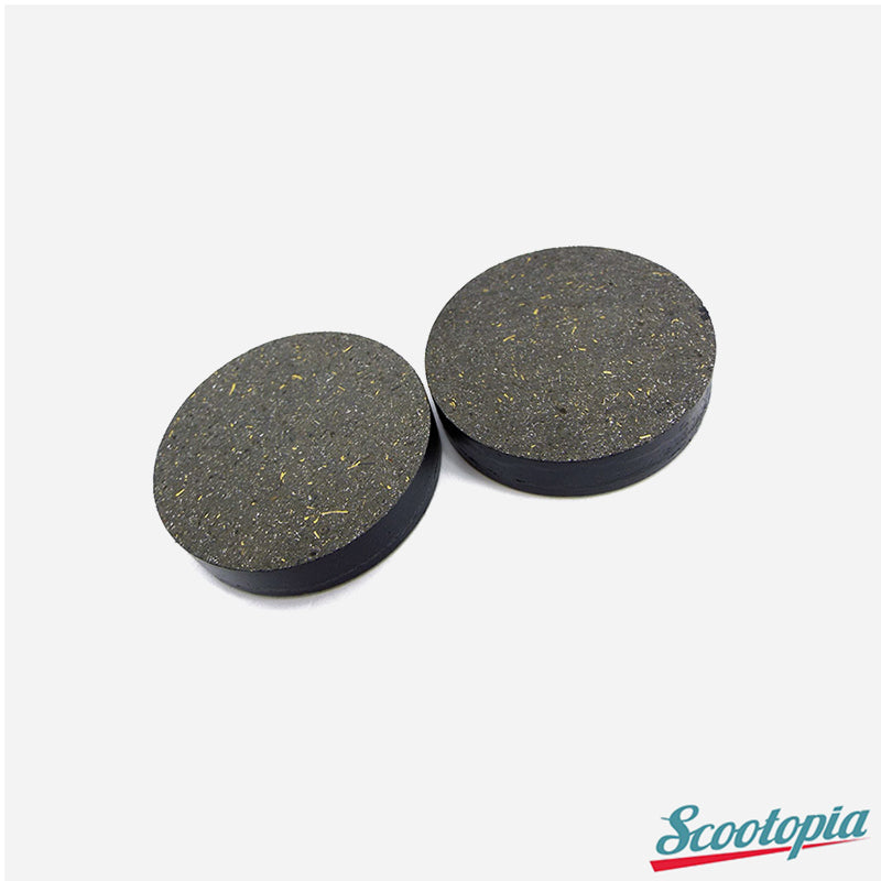 Two round black rubber pads on a white background with 'Scootopia' branding.