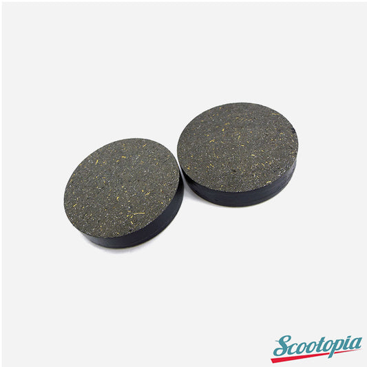 Two round black rubber pads on a white background with 'Scootopia' branding.